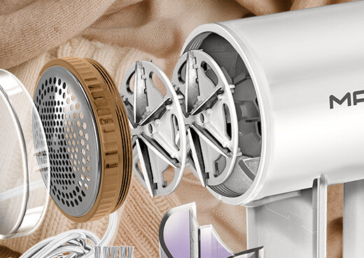 Przekrój golarki do ubrań MMU-06: dwie pary ostrzy, metalowa osłonka i przezroczysta osłonka.