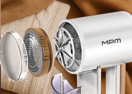 Przekrój golarki do ubrań MMU-06: ostrza, metalowa osłonka i przezroczysta osłonka.