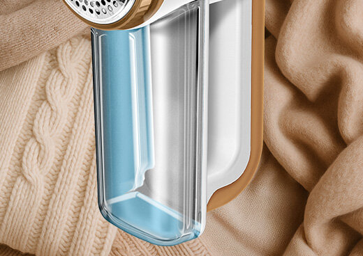 Zbliżenie na pojemnik na pozostałości strzyżenia golarki MMU-06.