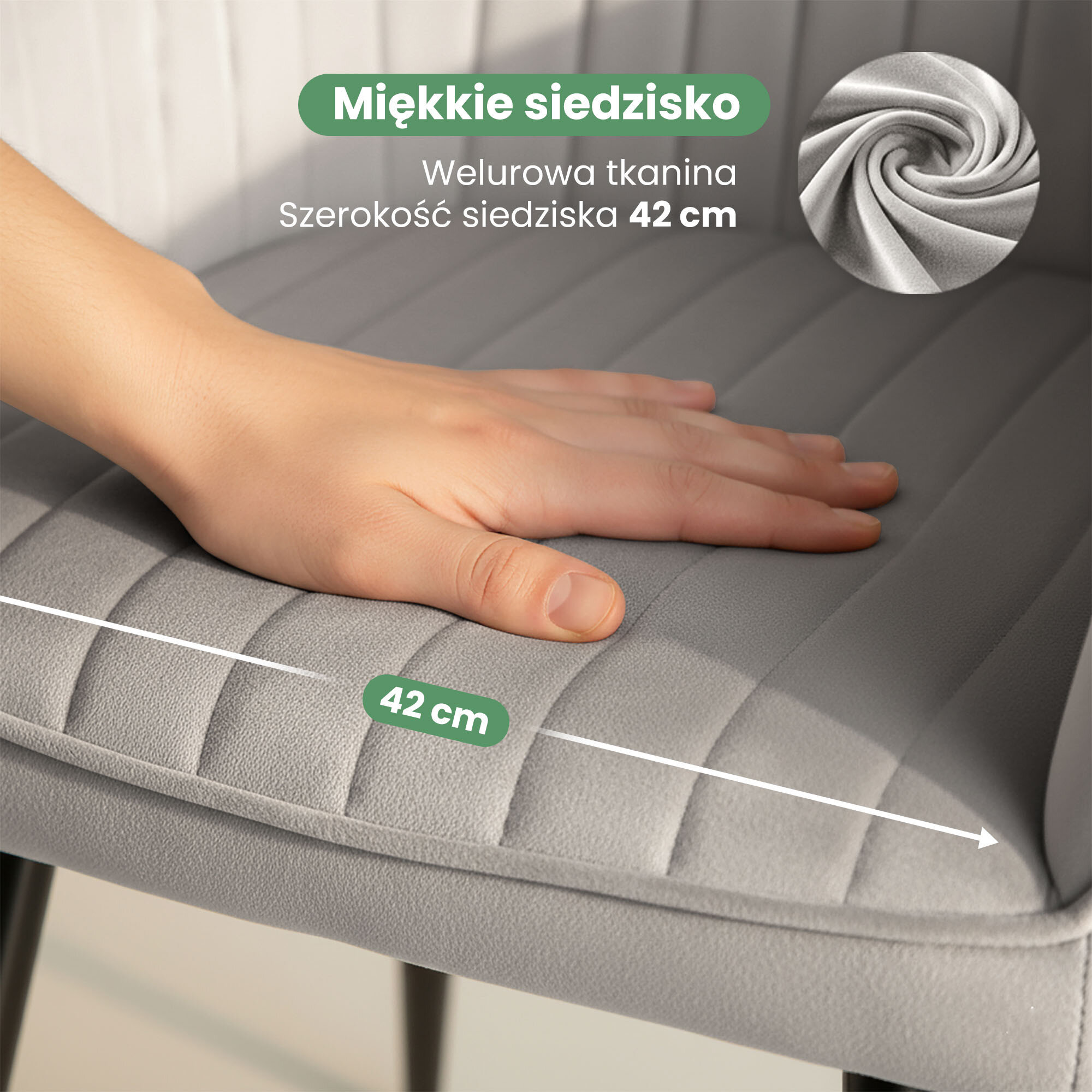 Na zdjęciu widać rękę dotykającą szarego, welurowego siedziska krzesła z przeszyciami. Widoczny tekst: \'Miękkie siedzisko, Welurowa tkanina, Szerokość siedziska 42 cm\'.
