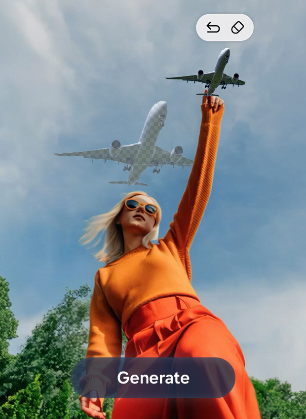 Osoba stoi na zewnątrz z uniesioną ręką. Nad głową, na częściowo zachmurzonym, błękitnym niebie, przelatuje samolot. W tle widać drzewa, a na dole widnieje napis „Generate”, oznaczający funkcję Photo Assist.