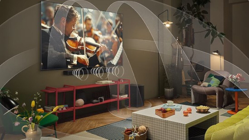 Telewizor LG 50UA75006LA UHD 4K α7 AI Gen8 WOW Orchestra współpraca z soundbarem LG szersza scena dźwiękowa, telewizor z soundbarem powieszony na ścianie, z którego wydobywa się dźwięk