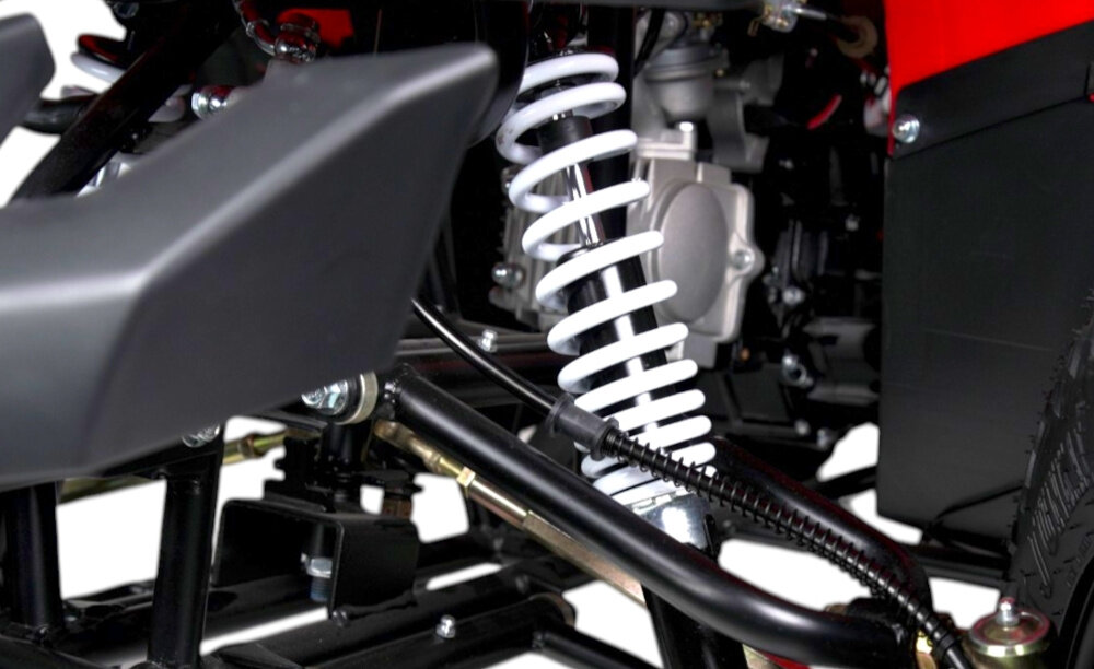 Quad TORQ Viper 125 3+1 VIP125RB-3 Czerwony zbliżenie na amortyzator Przednie niezależne zawieszenie wahaczowe z amortyzatorami tylny centralny amortyzator z regulacją ograniczać odczuwanie nierówności stabilniejsze zachowanie pojazdu Regulacja tylnego amortyzatora