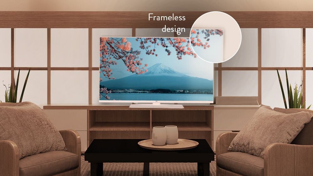 Telewizor JVC LT-32VAF330W biała obudowa bezramkowy ekran design, telewizor stojący na komodzie w pomieszczeniu