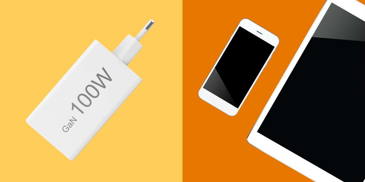 Obraz przedstawia białą ładowarkę z napisem \'GaN 100W\' na żółtym tle oraz smartfon i tablet na pomarańczowym tle.