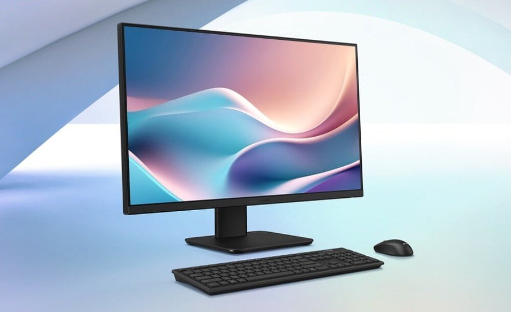 Komputer All in One ASUS ExpertCenter P470VAK-BPE911X Komputer typu All in One z czarną obudową, dopasowaną klawiaturą oraz myszką komputerową, zaprezentowany na jasnoniebieskim, geometrycznym tle z widoczną na ekranie grafiką przedstawiającą pastelowe fale, opis