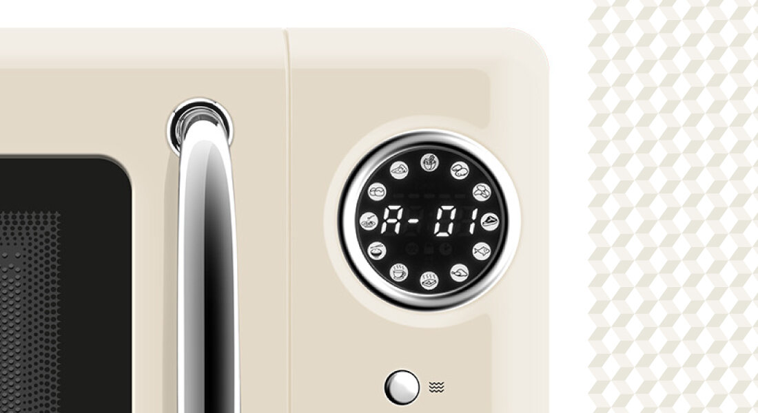 Fragment beżowej kuchenki mikrofalowej z okrągłym wyświetlaczem pokazującym \'A-01\' oraz przyciskiem poniżej. Obok wyświetlacza znajduje się uchwyt drzwiowy.