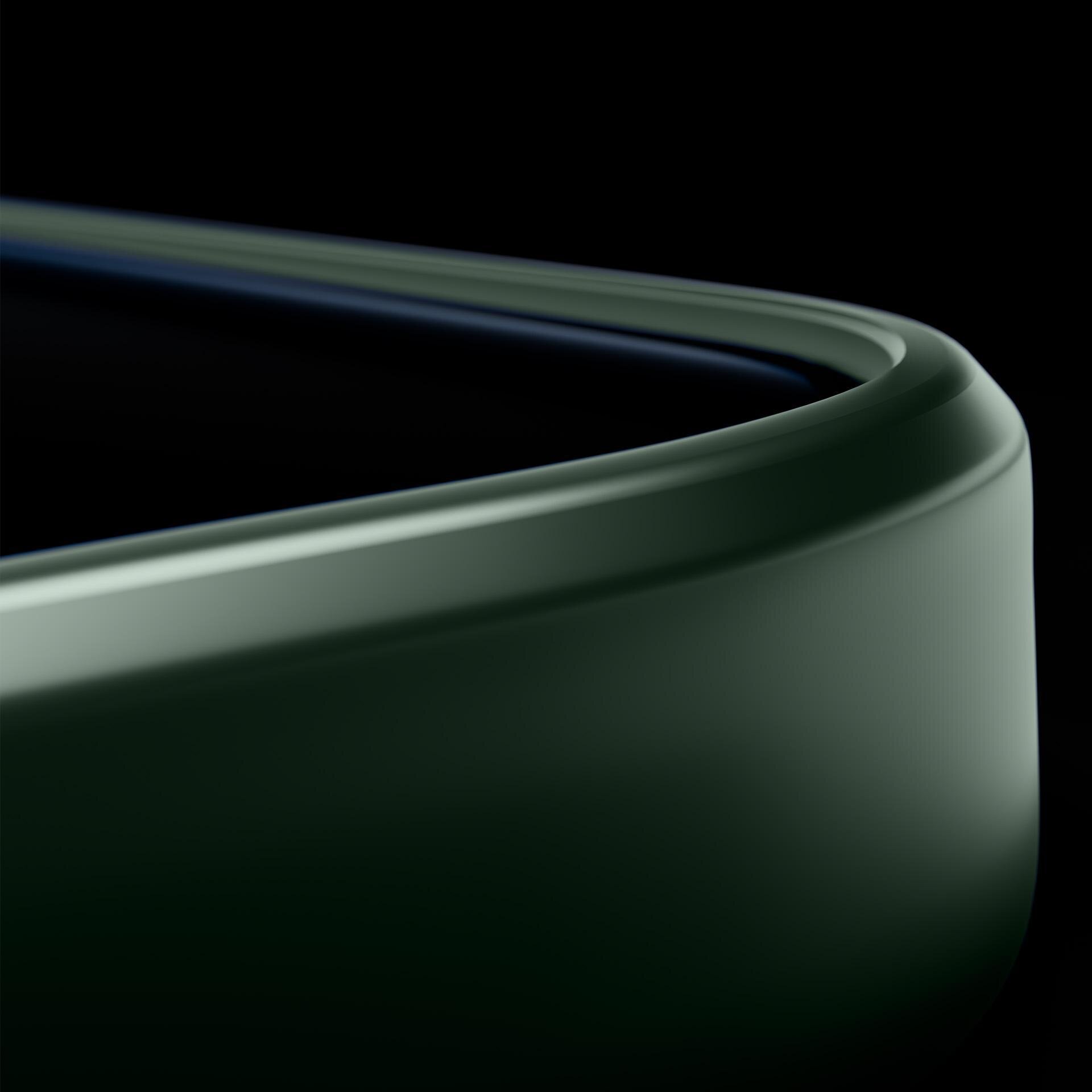 Zbliżenie na zaokrąglony narożnik zielonego etui na telefon, z widoczną gładką powierzchnią i subtelnymi liniami.