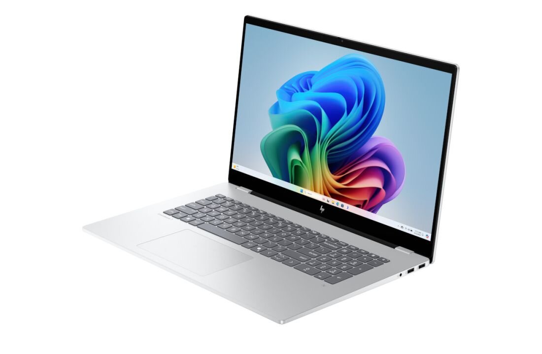 Laptop HP OmniBook w srebrnej obudowie z kolorową, abstrakcyjną tapetą na ekranie, symbolizujący długi czas pracy na baterii i mobilność do pracy kreatywnej. - Bateria o pojemności 83 Wh 