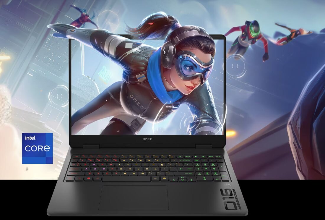 Laptop z kolorową klawiaturą wyświetla dynamiczną grafikę z postacią w goglach i niebieskim szaliku. Obok ekranu widoczne jest logo \'intel core\'.