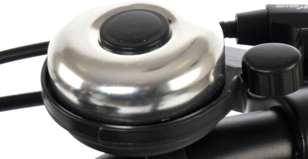 Rower młodzieżowy KARBON Superlight 24 cale dla chłopca Czarny białe tło zbliżenie na dzwonek praktyczny dzwonek sygnalizowanie obecności element zwiększający bezpieczeństwo