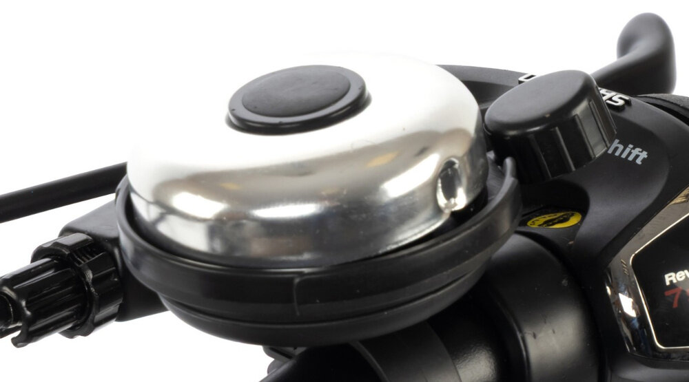 Rower dziecięcy KARBON Superlight 20 cali dla chłopca Czarny białe tło zbliżenie na dzwonek praktyczny dzwonek sygnalizowanie obecności element zwiększający bezpieczeństwo