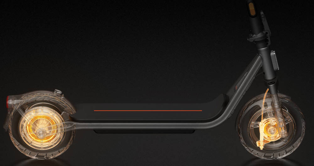 Hulajnoga elektryczna XIAOMI Electric Scooter 6 Lite Lite 25km 300W Amortyzacja 10 cali Czarny ciemne tło podświetlone na złoto hamulce podstawa bezpieczeństwa podwójny system hamulcowy przedni hamulec bębnowy tylny system E-ABS system E-ABS zapobiega blokowaniu się kół podczas hamowania