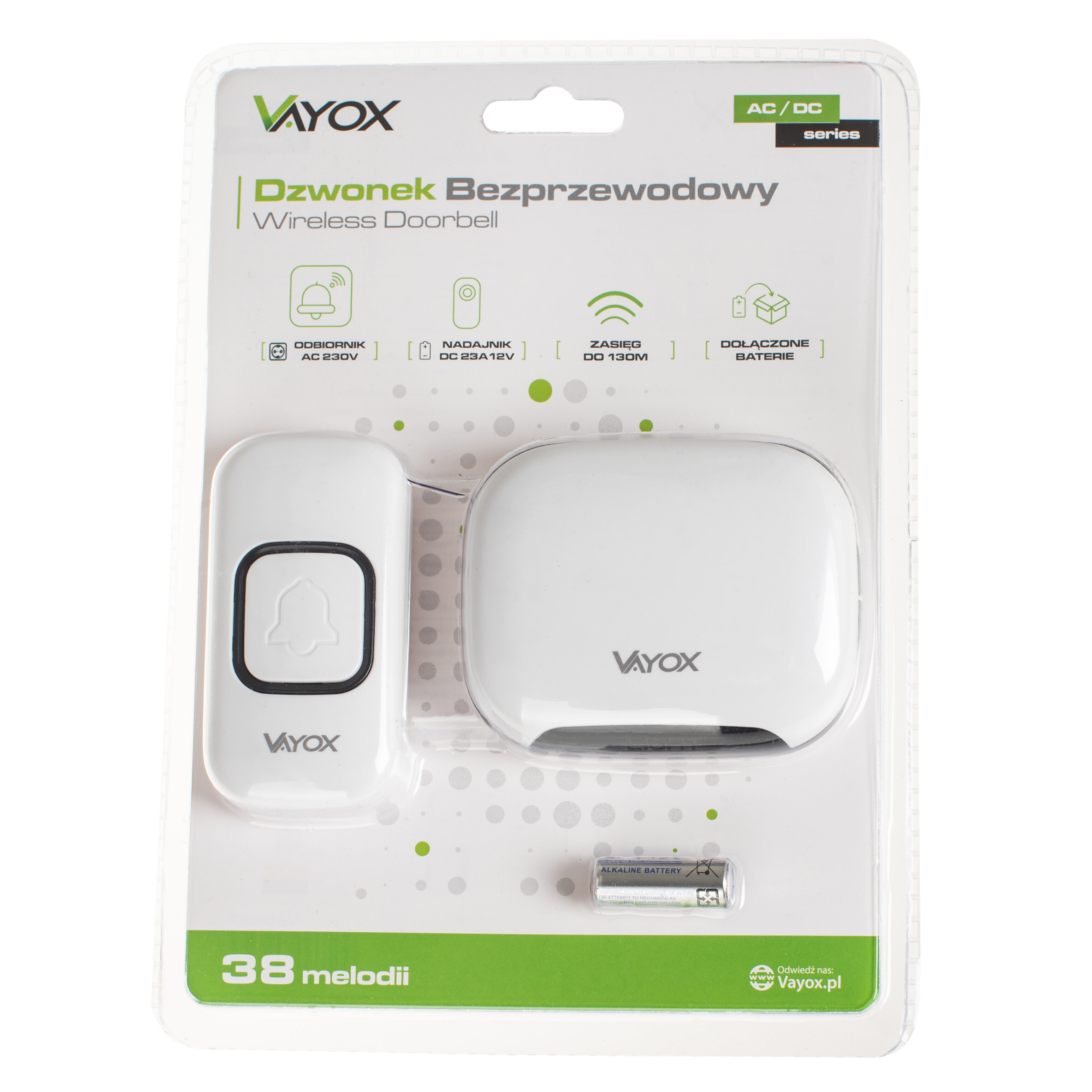 Na opakowaniu znajduje się biały, bezprzewodowy dzwonek do drzwi marki Vayox z napisem \'Dzwonek Bezprzewodowy Wireless Doorbell\'. Widoczne są dwa elementy zestawu oraz bateria, a także informacje o zasięgu do 130 m i 38 melodiach.