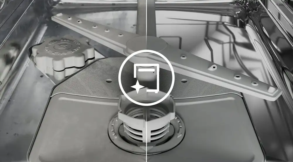 Wnętrze zmywarki z widocznym ramieniem spryskującym i filtrem. Na środku znajduje się ikona przedstawiająca zmywarkę z gwiazdką.