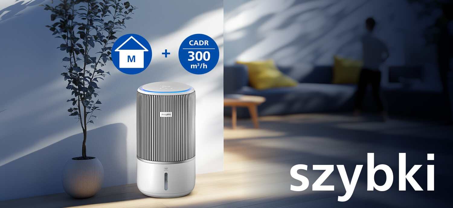 Oczyszczacz powietrza z logo PHILIPS stoi obok rośliny w doniczce, w jasnym pomieszczeniu. Na obrazie widoczne są ikony z tekstem \'M + CADR 300 m³/h\' oraz napis \'szybki\'.