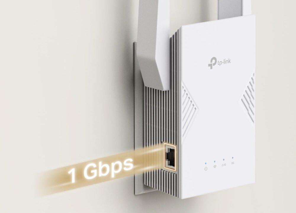 Na obrazie widoczny jest biały wzmacniacz sieci TP-Link z logo \'tp-link\' oraz portem Ethernet. Obok urządzenia znajduje się napis \'1 Gbps\'.