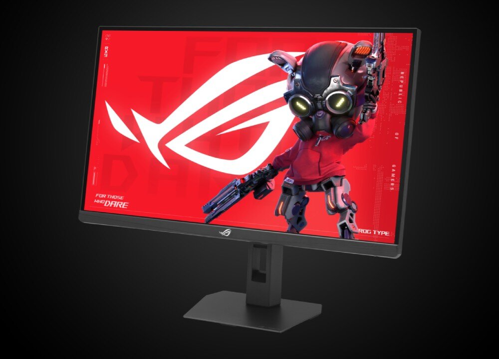 Monitor ASUS ROG Strix XG27JCG Monitor gamingowy ustawiony pod kątem, wyświetlający na jaskrawoczerwonym tle duży biały symbol i mechaniczną postać w masce i goglach z bronią, z jasnym logo producenta na dolnej ramce, odwzorowanie barw, jasność, HDR