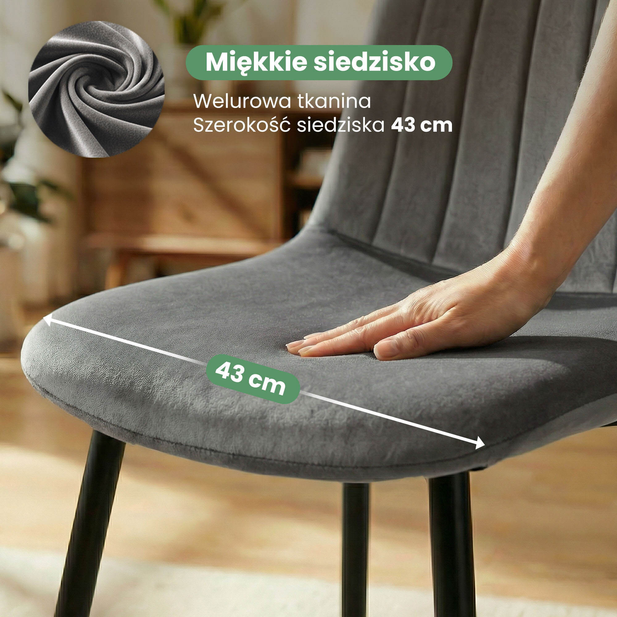 Obraz przedstawia welurowe krzesło tapicerowane w ciemnym grafitowym kolorze z czarnymi nogami. Widoczny jest tekst: \'Miękkie siedzisko, Welurowa tkanina, Szerokość siedziska 43 cm\'.