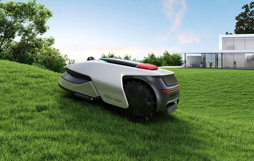 Robot koszący DREAME A2 1200 ogród trawnik robot kosi trawę na wzniesieniu w tle dom niebo silniki umieszczone bezpośrednio w piastach kół kąt nachylenia terenu do 50%, czyli 26,5° przyczepność i stabilność robota podczas koszenia na pochyłościach powierzchnia do 800 m² w ciągu 24 godzin w trybie standardowym do 1200 m² w ciągu 24 godzin w trybie wysokiej wydajności