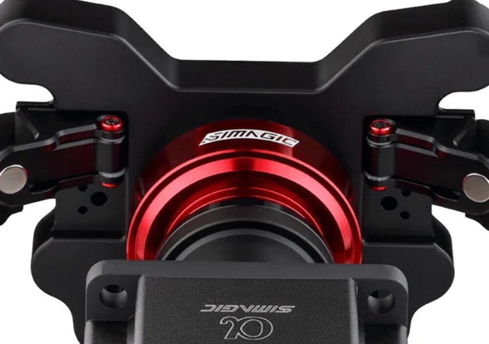 Kierownica SIMAGIC GT1 D-shape QR70 Zbliżenie na tylną część kierownicy z widocznym okrągłym mechanizmem mocującym oraz metalowymi elementami konstrukcyjnymi ramion