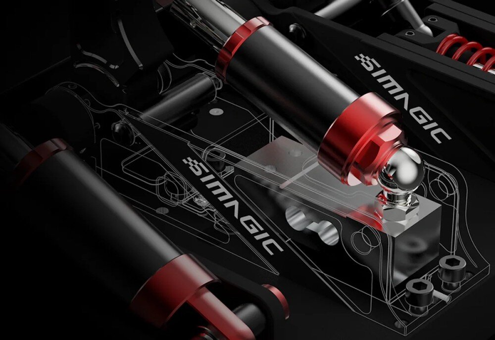 Zestaw SIMAGIC P1000-FRS S307 Formula Style Zbliżenie na mechanizm hydrauliczny z cylindrami i napisem Simagic umieszczony przy podstawie pedałów wyścigowych