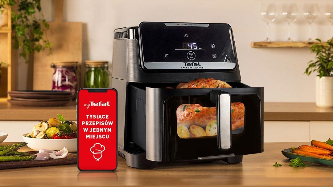 Frytkownicy TEFAL Easy Fry Silence EY8468 na kuchennym blacie z wysuniętym koszem, obok smartfon z aplikacją MyTefal.