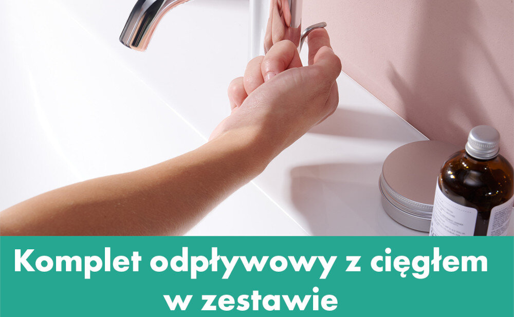 BATERIA UMYWALKOWA HANSGROHE TECTURIS Zbliżenie na baterię umywalkową oraz dłoń pociągającą za cięgno odpływu przy umywalce. Na dole widoczny napis „Komplet odpływowy z cięgnem w zestawie”, podkreślający dołączone akcesoria kompletny zestaw odpływowy korek z cięgłem łatwy montaż węże G 3 8 podgrzewacz przepływowy