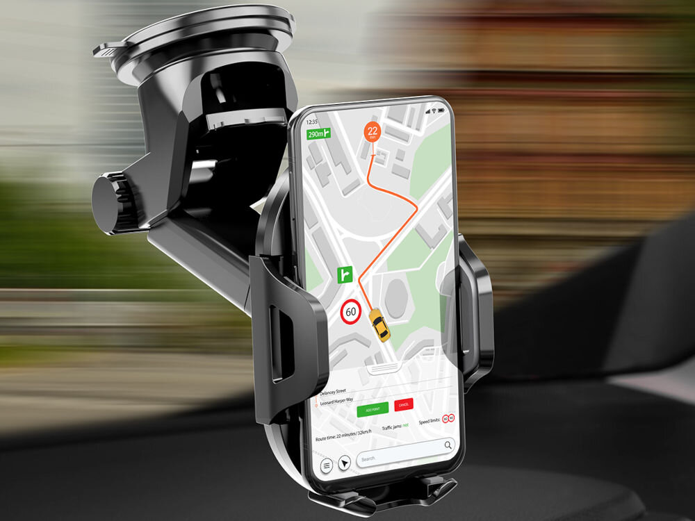 Czarny uchwyt samochodowy na szybę trzyma smartfon z wyświetloną mapą i trasą na ekranie. Uchwyt ma solidną konstrukcję z przyssawką do montażu.