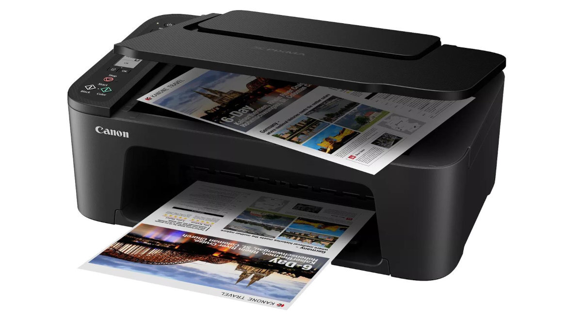 Czarne urządzenie wielofunkcyjne Canon Pixma z funkcją druku w kolorze i Wi-Fi, z widocznymi wydrukowanymi stronami. Na obudowie znajduje się logo \'Canon\'.