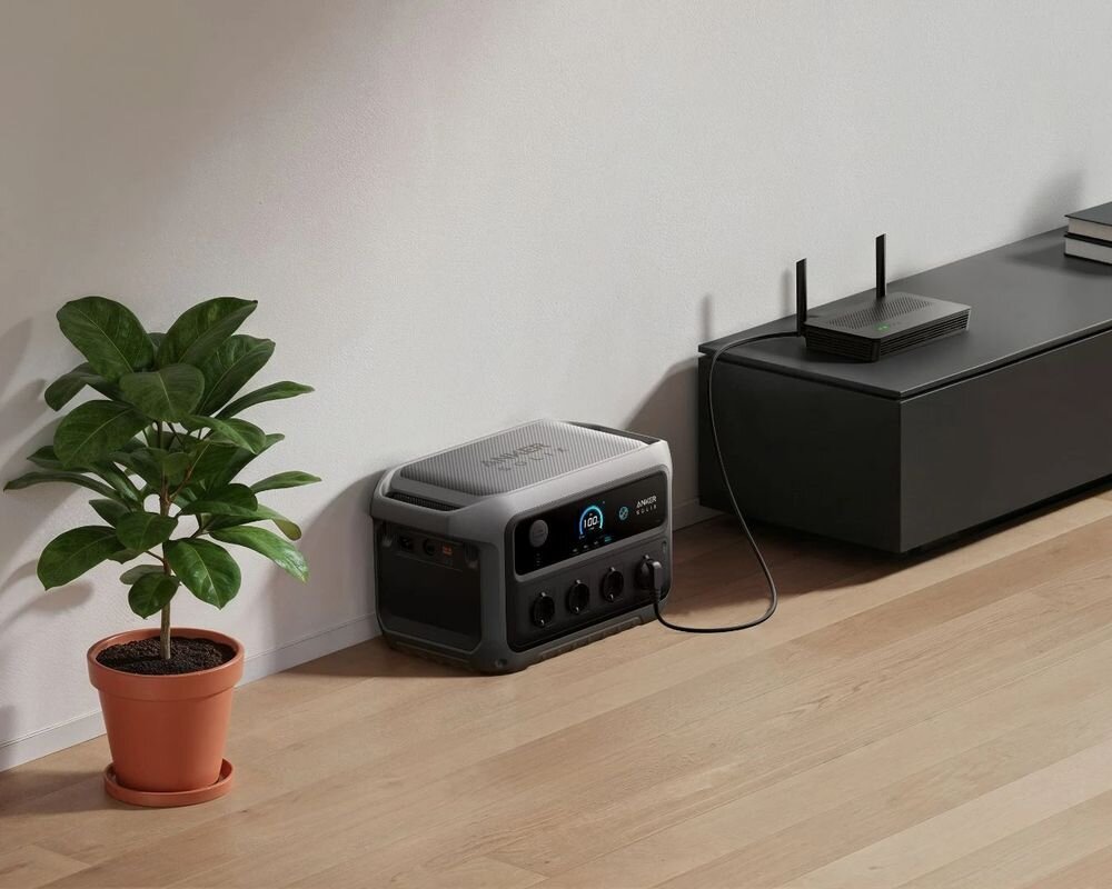 Stacja zasilania ANKER Solix C2000 Gen 2, awaria, dom, ochrona, zasilanie, Stacja zasilania Anker Solix podłączona do routera Wi-Fi w jasnym salonie.