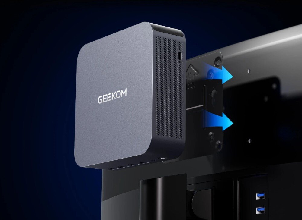 Komputer GEEKOM GT1-Mega Urządzenie mocowane z tyłu monitora komputerowego za pomocą czarnego uchwytu montażowego na ciemnoniebieskim tle, wymiary, wielkość, uchwyt VESA