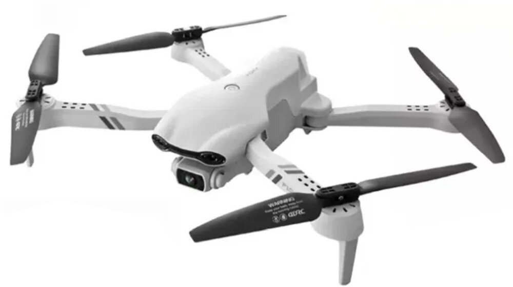 Dron EXTRALINK Smart Life F10 Dron w locie z widocznymi czterema rozłożonymi ramionami i śmigłami, ukazany z lekkiego boku