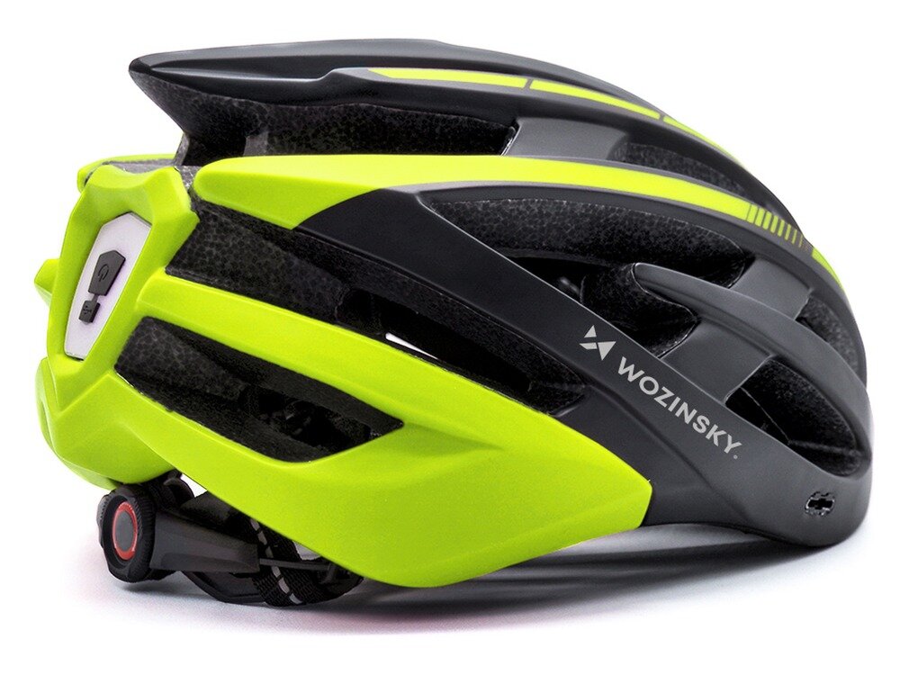 Kask rowerowy w kolorze czarno-żółtym z widocznym logo \'WOZINSKY\'. Na kasku znajduje się lampka oraz elementy wentylacyjne.
