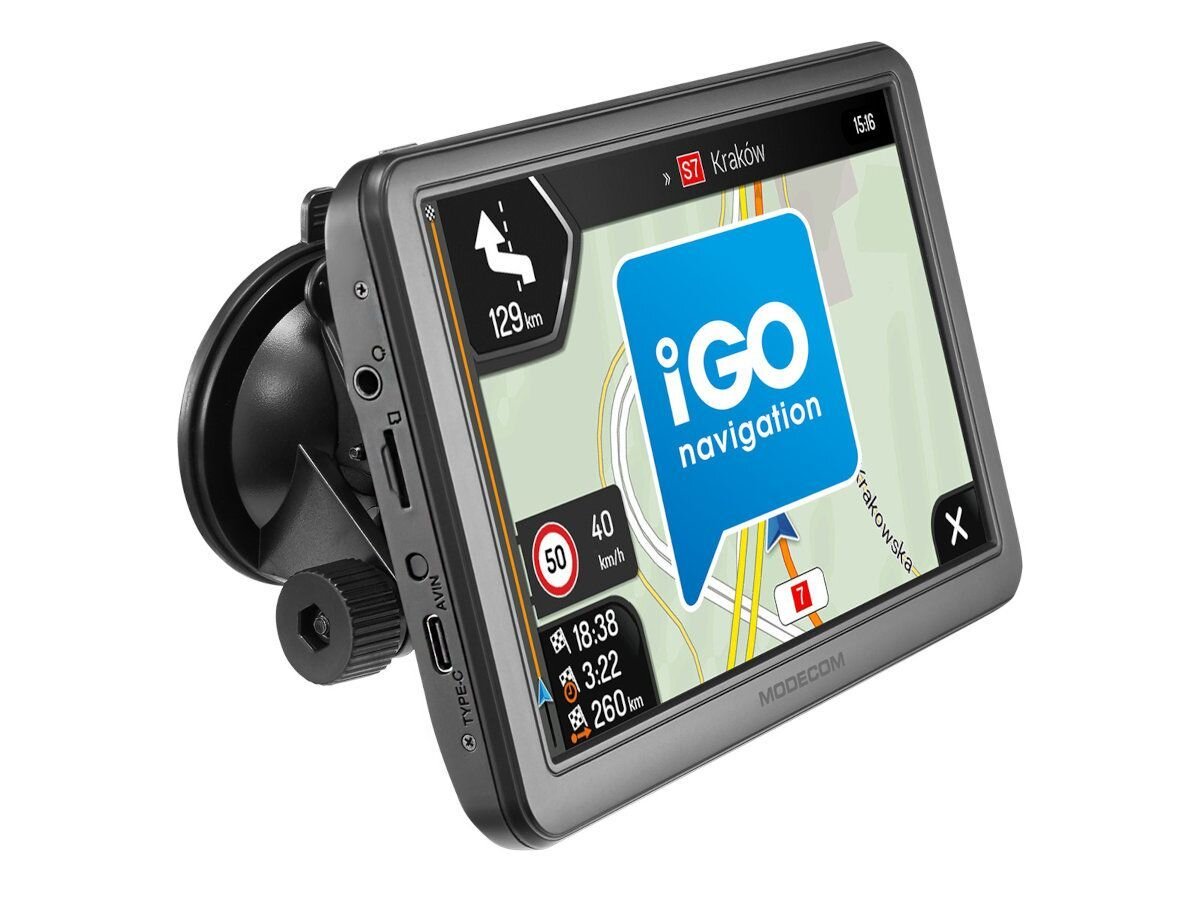 Urządzenie nawigacyjne z wyświetlaczem pokazującym mapę z trasą do Krakowa, logo \'iGO navigation\' oraz informacje o odległości i prędkości. Obudowa posiada przyciski i złącza, a na ekranie widoczny jest napis \'MODECOM\'.