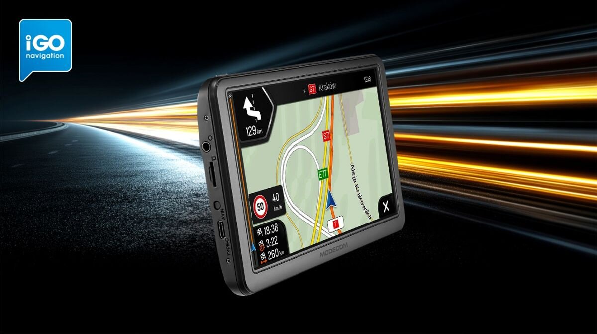 Urządzenie nawigacyjne z wyświetlaczem pokazującym mapę z trasą do Krakowa, prędkość 40 km/h i odległość 129 km. W tle widoczna jest droga z efektem świetlnym, a w lewym górnym rogu znajduje się logo \'iGO navigation\'.