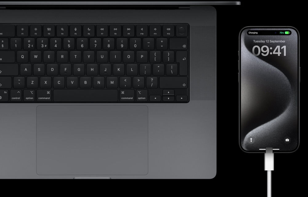 Obraz przedstawia klawiaturę laptopa oraz smartfon z wyświetlaczem pokazującym datę Tuesday 12 September i godzinę 09:41. Na ekranie smartfona widoczny jest wskaźnik ładowania z napisem Charging i poziomem 75%.