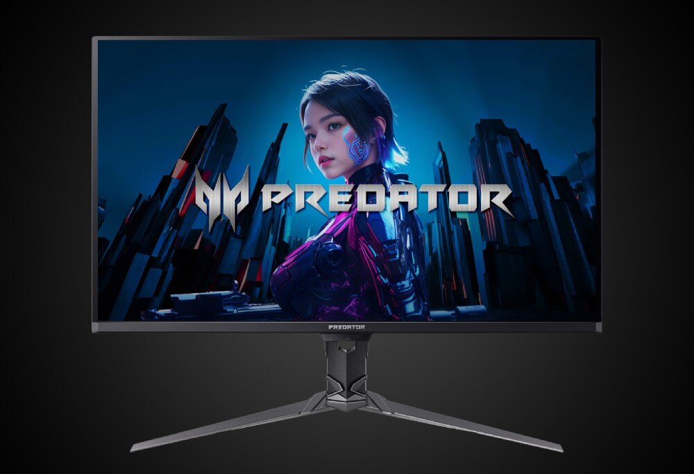 Monitor ACER Predator X32X5bmiiphuzx Monitor widziany od przodu z włączonym ekranem przedstawiającym postać i napis 'PREDATOR' na tle budynków