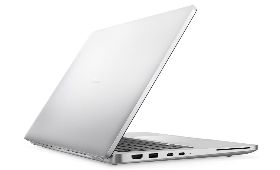 Srebrny laptop z otwartą pokrywą, widoczne porty po jednej stronie obudowy. Na pokrywie znajduje się logo producenta.