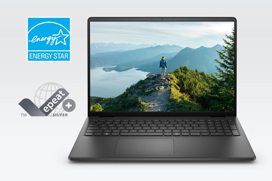 Na obrazie widoczny jest laptop z wyświetlaczem pokazującym osobę stojącą na górskim szlaku z widokiem na jezioro i góry. Obok laptopa znajdują się loga \'ENERGY STAR\' i \'epeat silver\'.