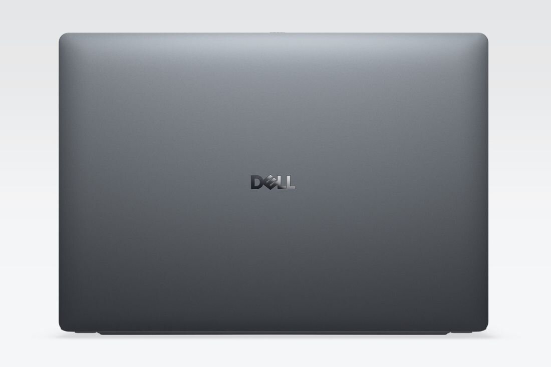 Obraz przedstawia zamknięty laptop w kolorze szarym z widocznym logo \'DELL\' na środku pokrywy. Tło jest jednolite i jasne.