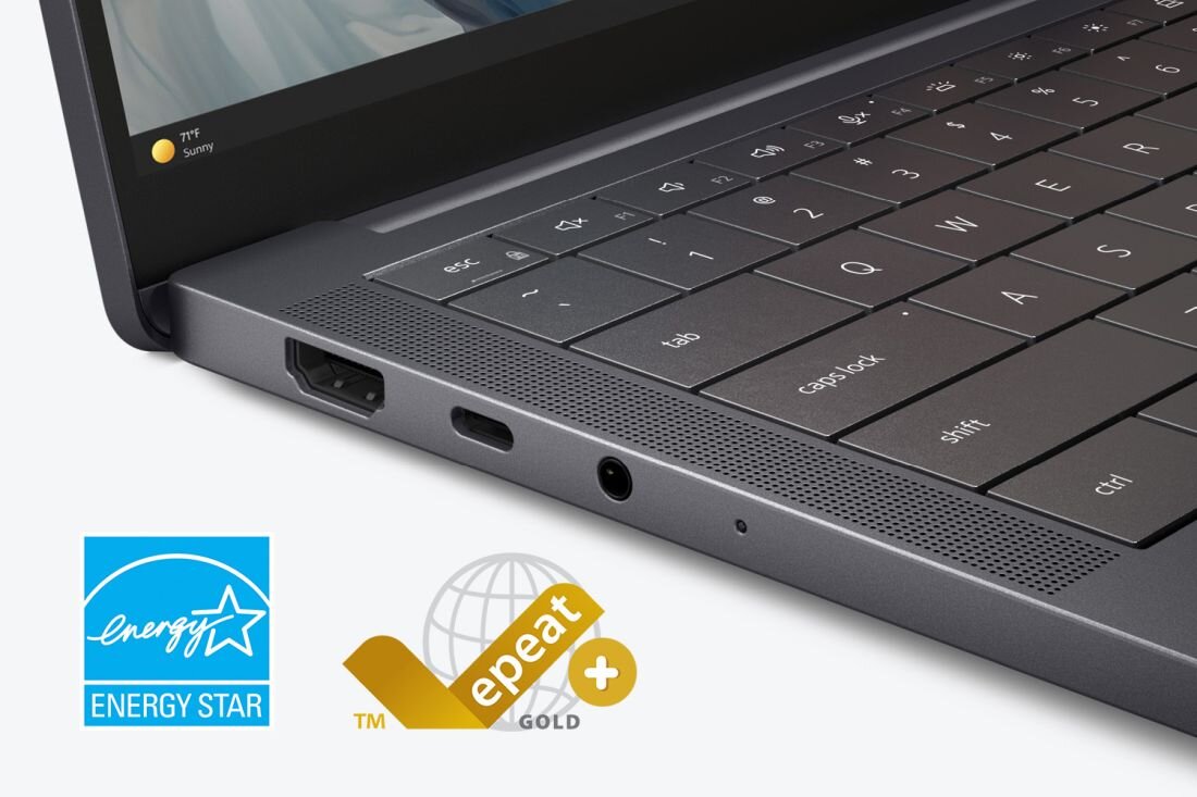 Na obrazie widoczny jest fragment klawiatury laptopa z portami po boku. W dolnej części znajdują się loga \'Energy Star\' i \'epeat gold\'.