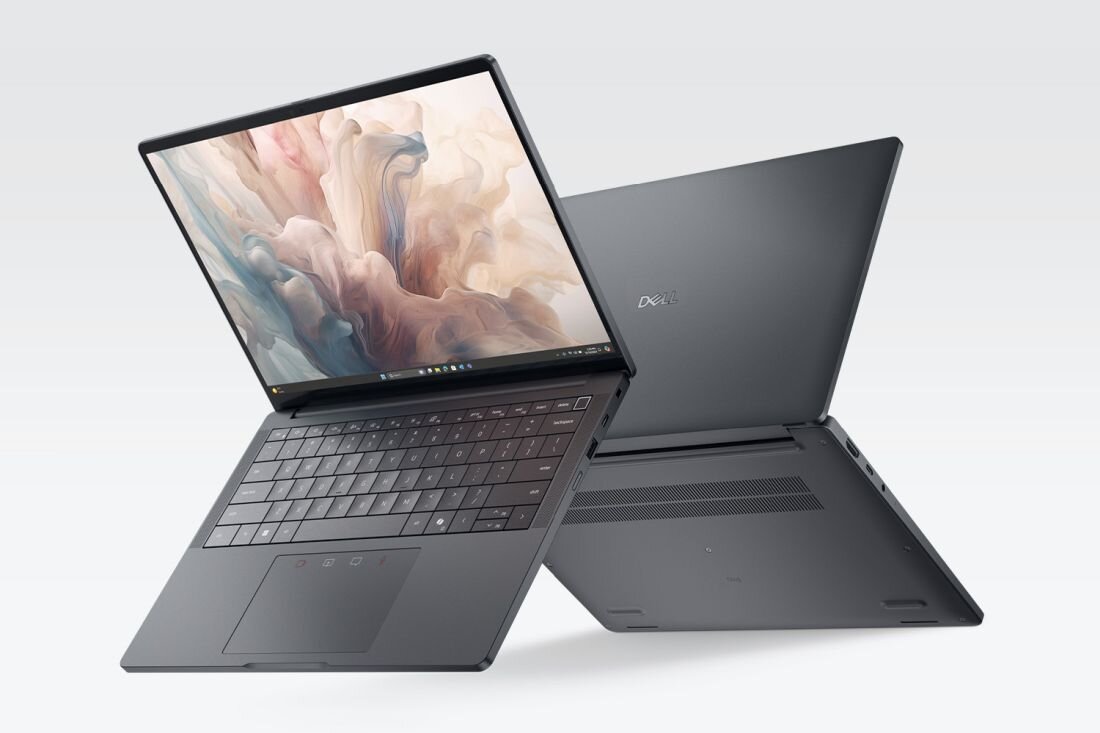 Na obrazie widoczne są dwa laptopy w kolorze ciemnoszarym, jeden otwarty z widoczną klawiaturą i ekranem, drugi zamknięty z widocznym logo \'Dell\'.