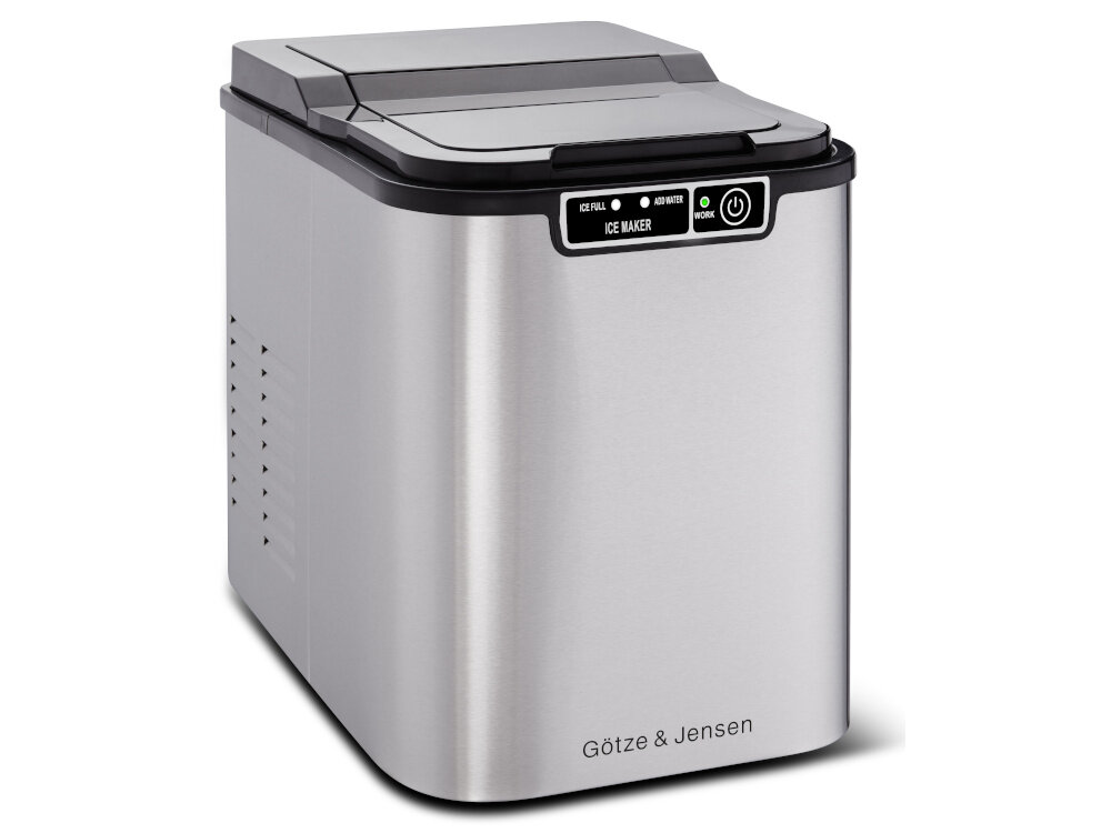 Srebrna kostkarka do lodu z czarnym panelem sterowania, na którym widnieją napisy: \'ICE FULL\', \'ADD WATER\', \'ICE MAKER\', \'WORK\'. Na dole urządzenia znajduje się logo \'Götze & Jensen\'.