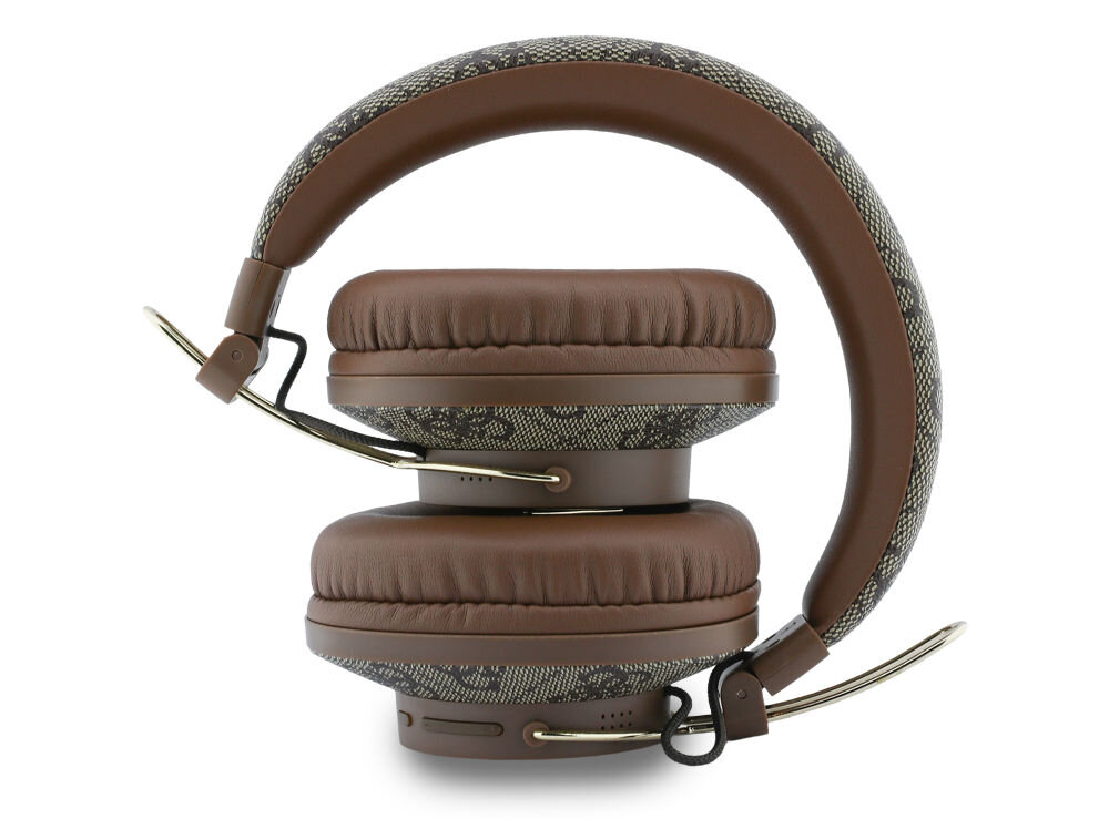 Brązowe słuchawki nauszne z widocznym wzorem na pałąku i nausznikach. Słuchawki mają metaliczne elementy i są złożone w kompaktowy sposób.