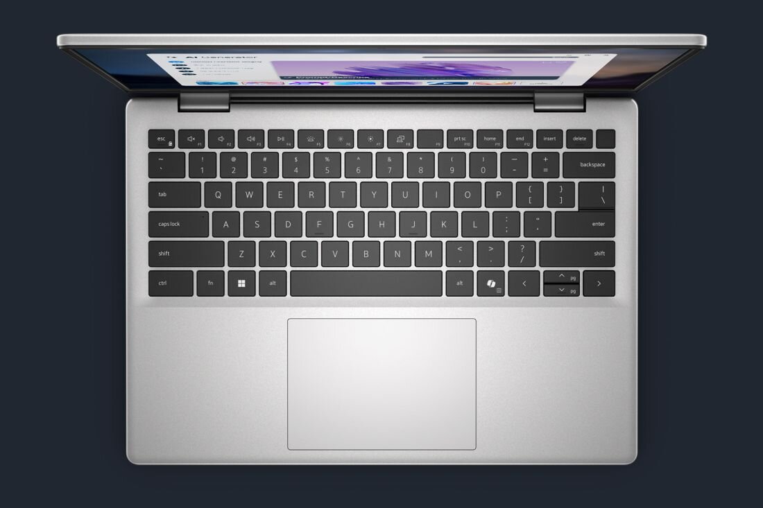 Zbliżenie na klawiaturę laptopa Dell 14 pokazuje układ klawiszy oraz gładzik w aluminiowej obudowie - Dedykowany przycisk Copilot 