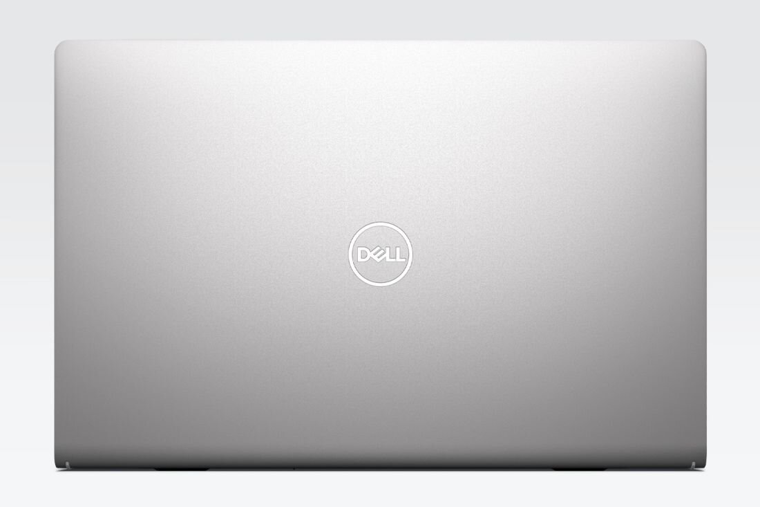 Zamknięta obudowa laptopa Dell 15 pokazana od góry eksponuje minimalistyczny design z centralnie umieszczonym logo Dell - OBUDOWA I TRWAŁOŚĆ