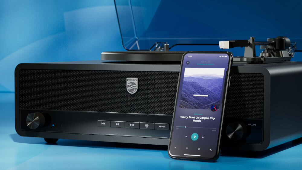 PHILIPS TAV3000B/10 gramofon Bluetooth dwukierunkowy Auracast, gramofon po skosie z opartym smartfonem na niebieskim tle