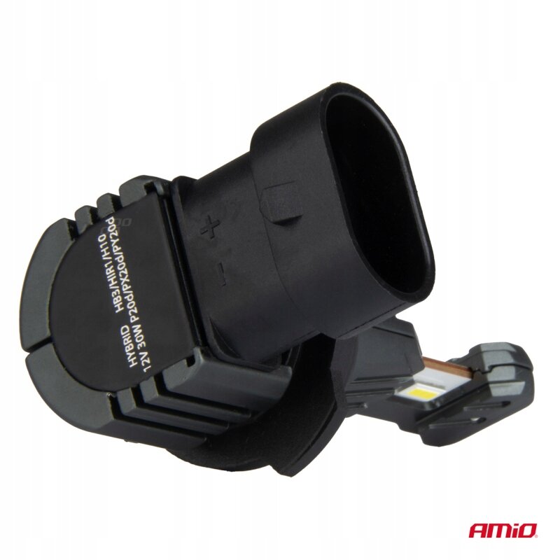 Czarna żarówka LED z widocznymi oznaczeniami: \'HYBRID HB3/HIR1/H10 12V 30W P20d/PX20d/PY20d\'. W prawym dolnym rogu znajduje się czerwone logo \'Amio\'.
