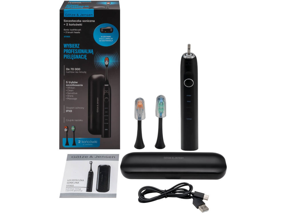 Szczoteczka soniczna GÖTZE & JENSEN ST955 Pełny zestaw Götze & Jensen ST955: szczoteczka soniczna, 2 końcówki, etui z lampą UV, kabel USB i instrukcja na tle opakowania.